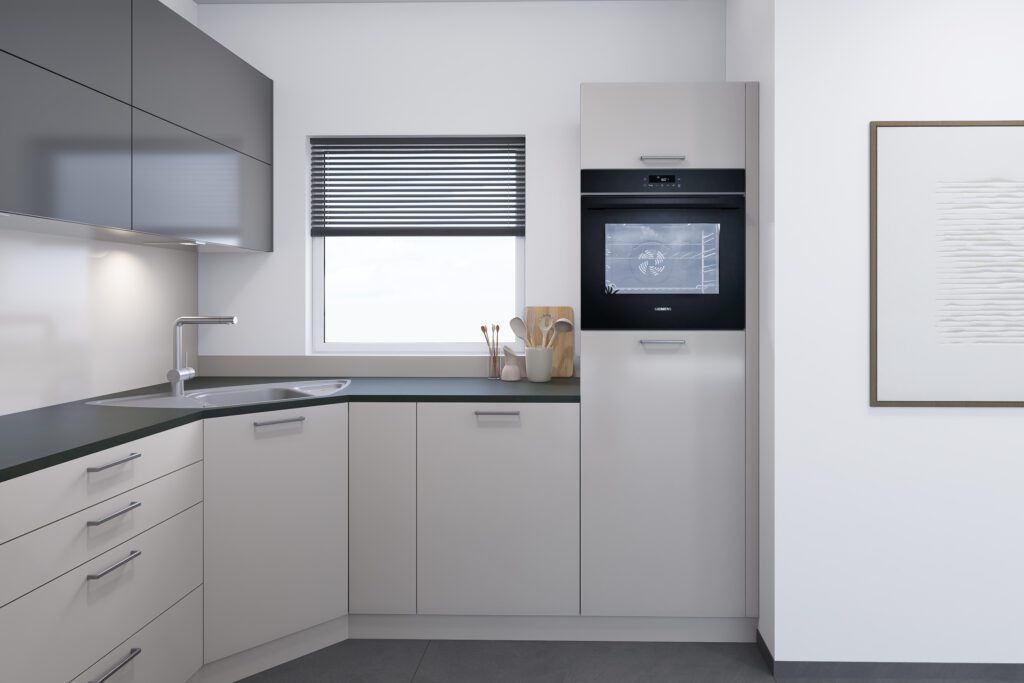 Ecklösung mit Spüle und hochgebautem Backofen.