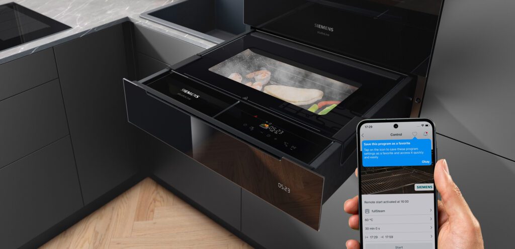 Dampfschublade mit Inhalt und Smartphone zur Steuerung von Siemens